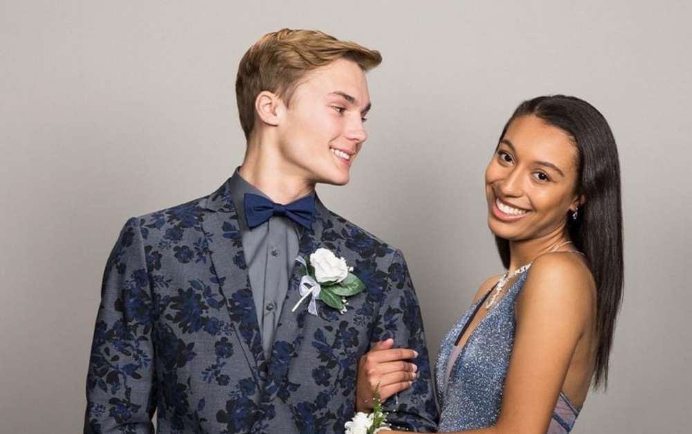 A couple dressed to attend prom 