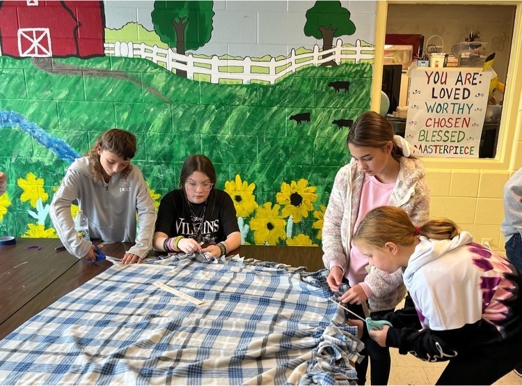 Students making quilt  