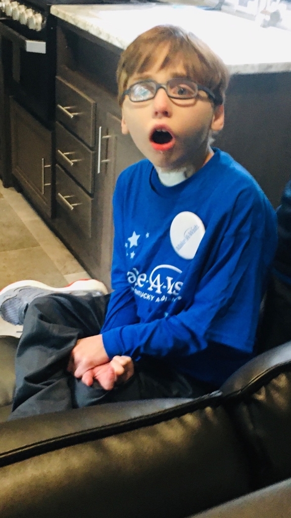 Picture of Josh wearing his blue Make-A-Wish shirt and button. 