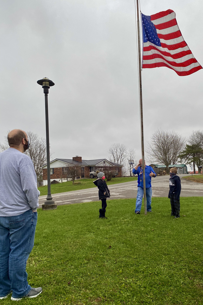 Lowering the flag to half staff 