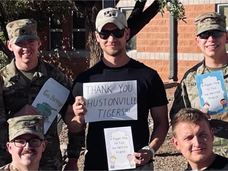 Soldiers with thank you cards  